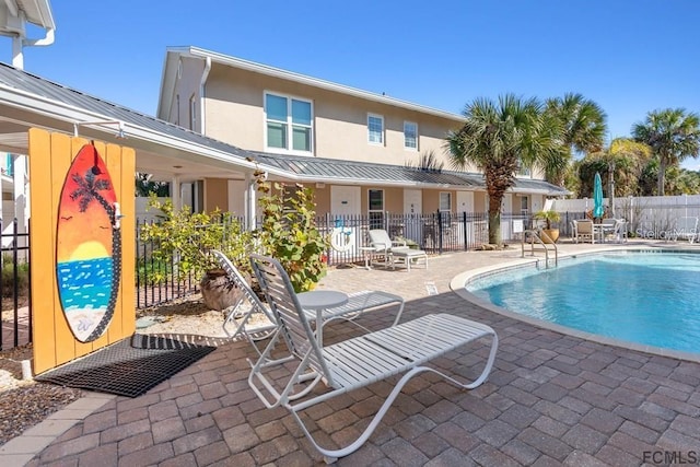 view of swimming pool featuring a patio area