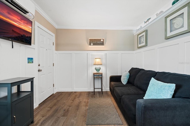 living room with crown molding and dark hardwood / wood-style flooring