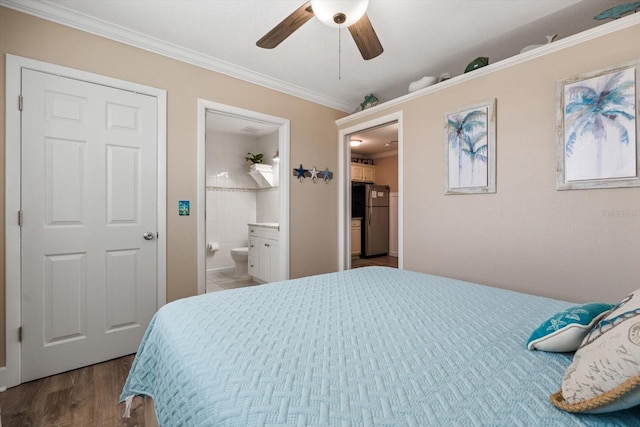 bedroom featuring connected bathroom, stainless steel refrigerator, ornamental molding, hardwood / wood-style flooring, and ceiling fan