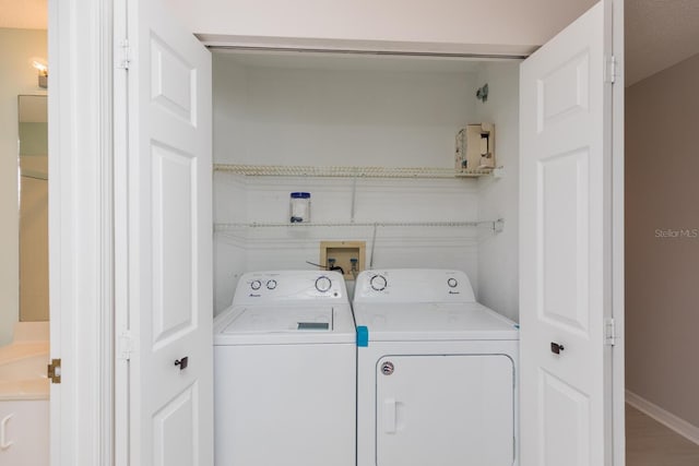 laundry room with separate washer and dryer