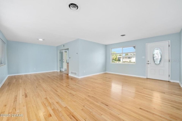 foyer with light wood-type flooring