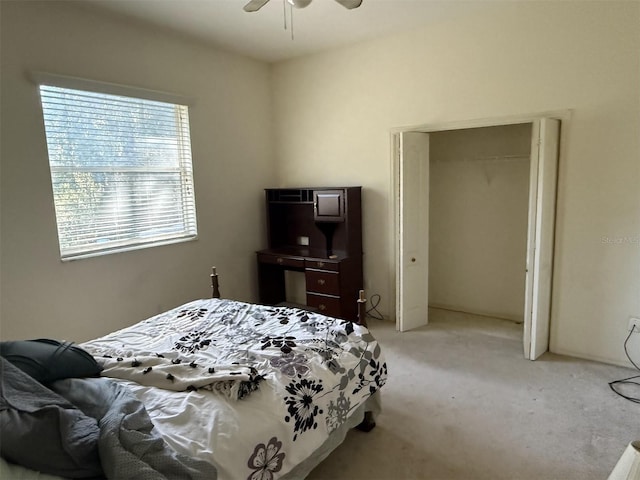 bedroom featuring light carpet, a closet, and ceiling fan