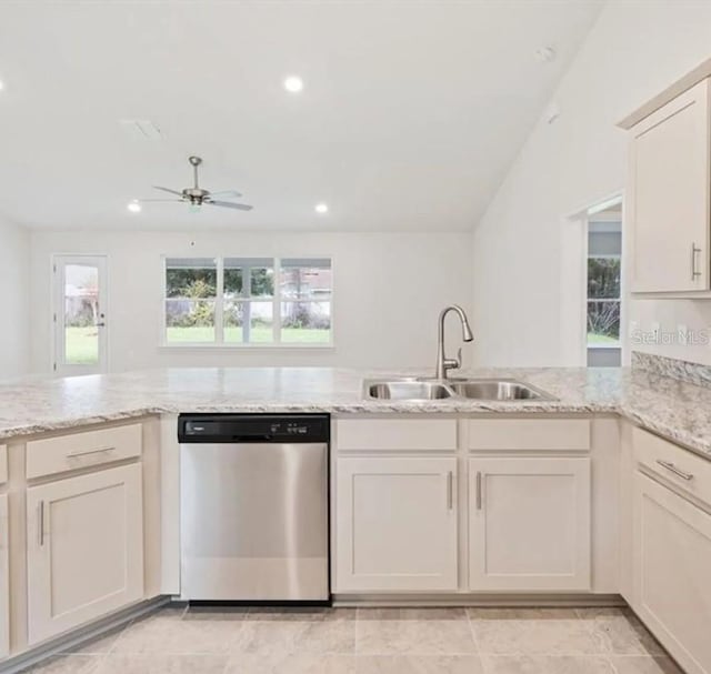 kitchen featuring a ceiling fan, dishwasher, light stone counters, a sink, and recessed lighting