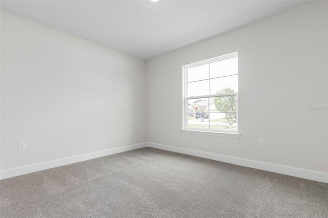 13 Primrose Ln, Palm Coast, FL 32164 - carpeted spare room with baseboards
