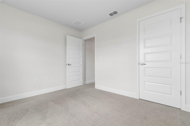13 Primrose Ln, Palm Coast, FL 32164 - carpeted empty room featuring baseboards