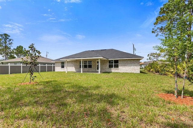 13 Primrose Ln, Palm Coast, FL 32164 - rear view of property featuring brick siding
