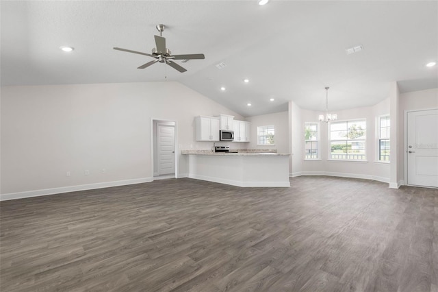 13 Primrose Ln, Palm Coast, FL 32164 - unfurnished living room featuring a chandelier, lofted ceiling, dark wood-style floors, a ceiling fan, and recessed lighting