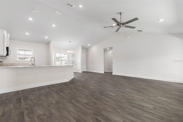 13 Primrose Ln, Palm Coast, FL 32164 - unfurnished living room with dark wood finished floors, lofted ceiling, ceiling fan, baseboards, and recessed lighting