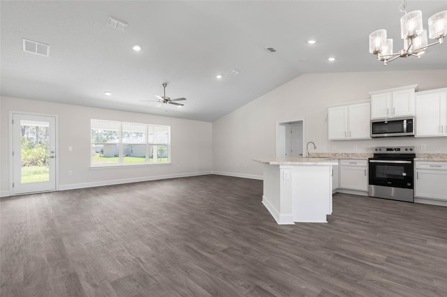 13 Primrose Ln, Palm Coast, FL 32164 - kitchen with appliances with stainless steel finishes, open floor plan, vaulted ceiling, a chandelier, and dark wood-style flooring