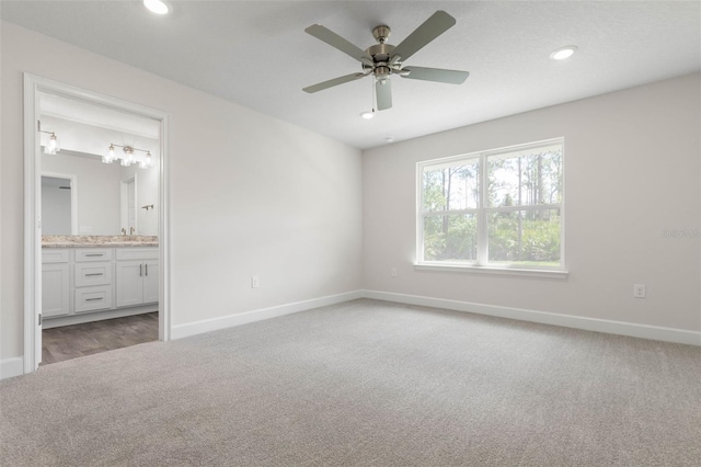 13 Primrose Ln, Palm Coast, FL 32164 - unfurnished bedroom featuring carpet, baseboards, recessed lighting, and ensuite bathroom
