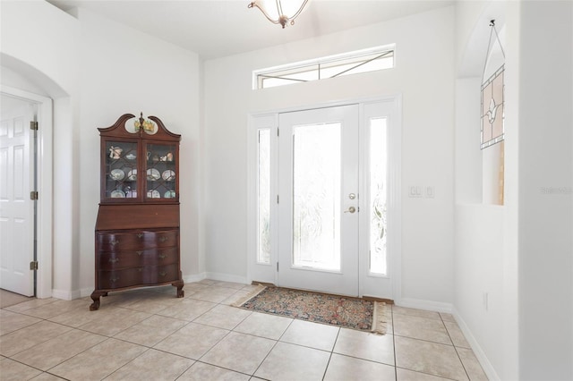 foyer entrance with light tile patterned floors