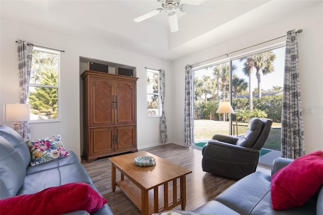 living room featuring hardwood / wood-style floors, plenty of natural light, and ceiling fan