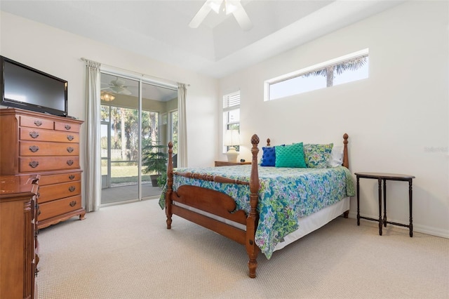 carpeted bedroom featuring access to exterior and ceiling fan