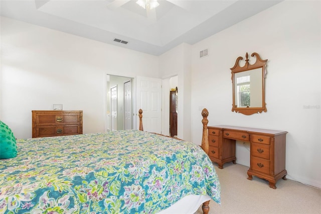 bedroom with light colored carpet and ceiling fan