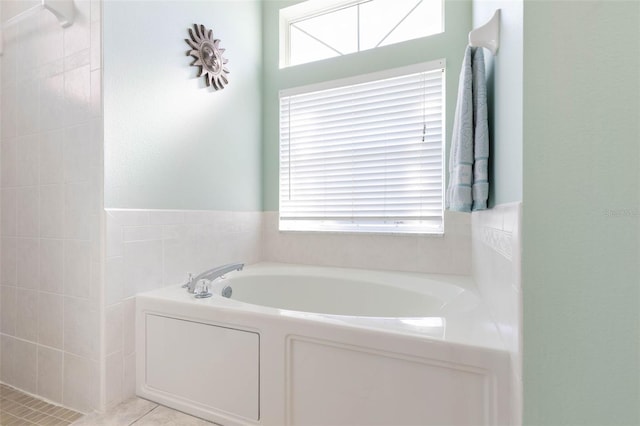 bathroom featuring tile patterned flooring and a bathtub