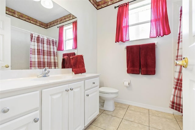 bathroom featuring vanity, a shower with curtain, tile patterned floors, and toilet