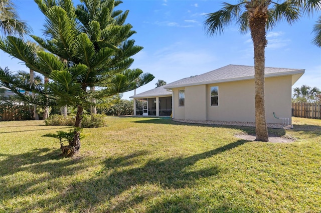 view of yard with a sunroom