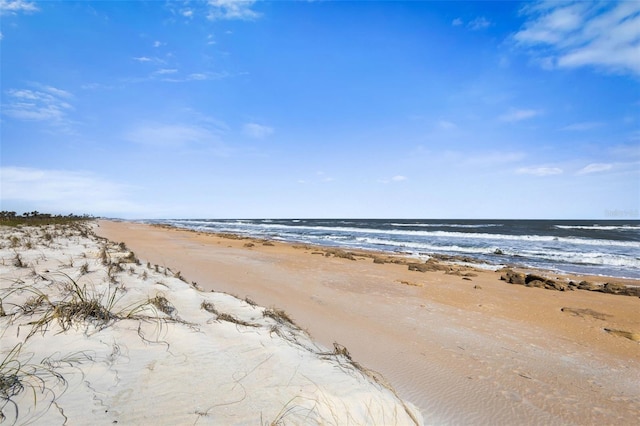 property view of water featuring a view of the beach