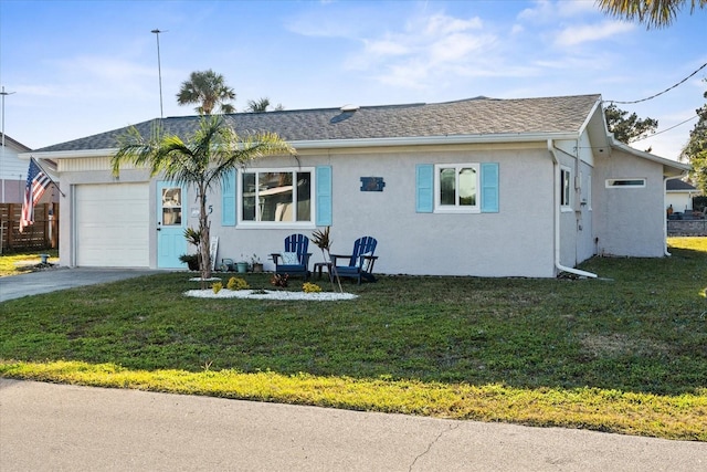 view of front of home featuring a garage and a front yard