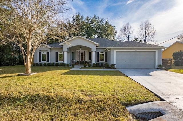 single story home with a garage and a front lawn