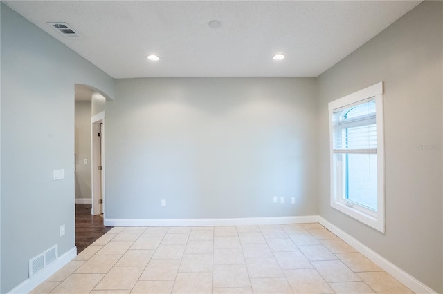 empty room with light tile patterned floors