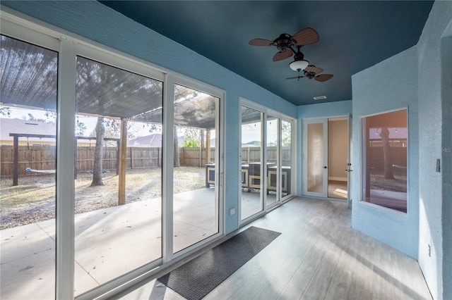 entryway featuring ceiling fan and light hardwood / wood-style floors