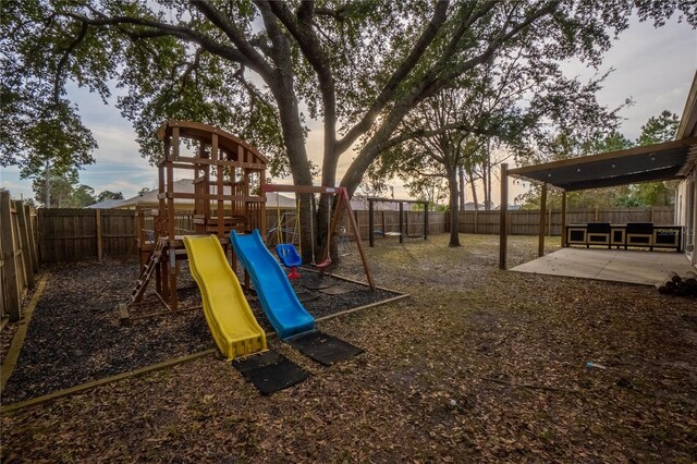 playground at dusk with a patio area