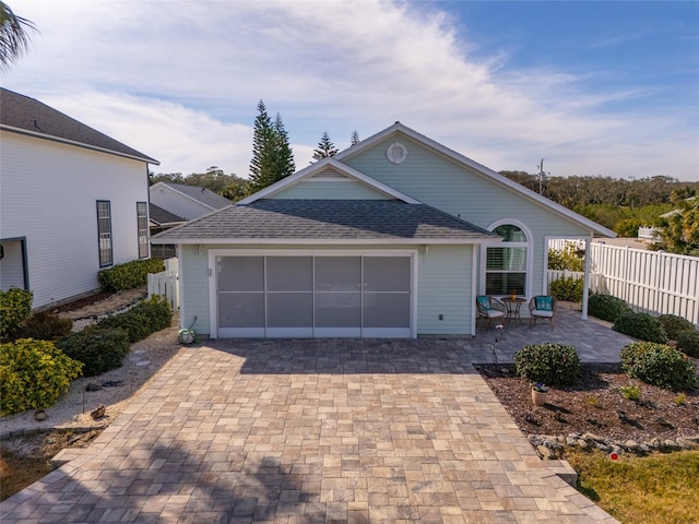 exterior space featuring a garage and a patio