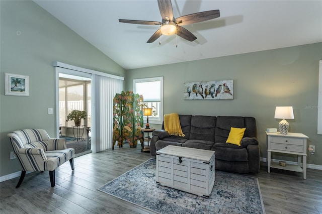 living room with wood-type flooring, ceiling fan, and vaulted ceiling