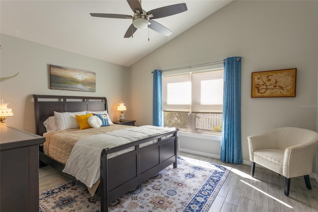 bedroom featuring vaulted ceiling, wood-type flooring, and ceiling fan