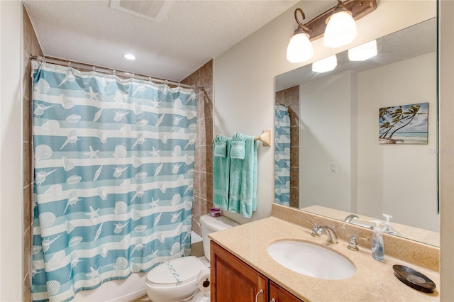 full bathroom featuring vanity, shower / tub combo, a textured ceiling, and toilet