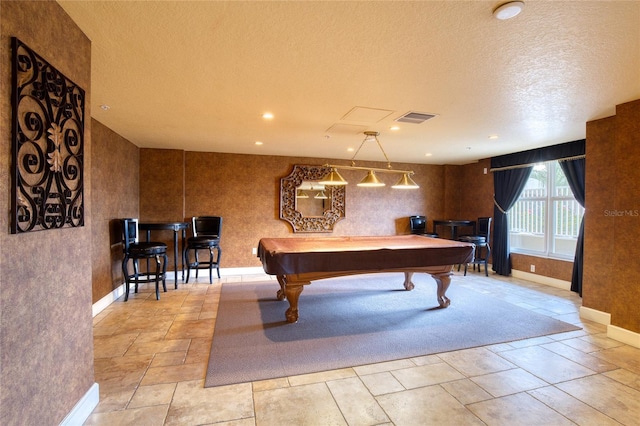 rec room featuring pool table and a textured ceiling