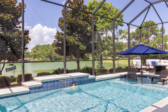 view of pool featuring outdoor lounge area, pool water feature, glass enclosure, a water view, and a patio area