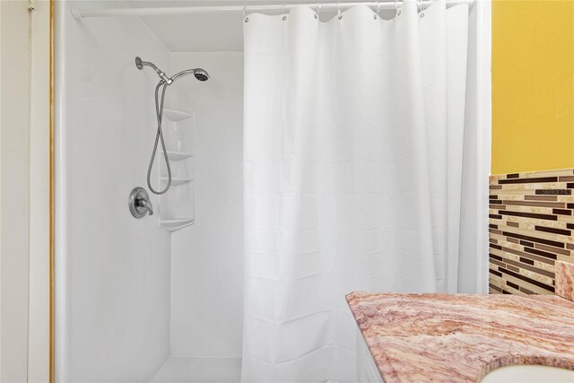 bathroom with a shower with curtain