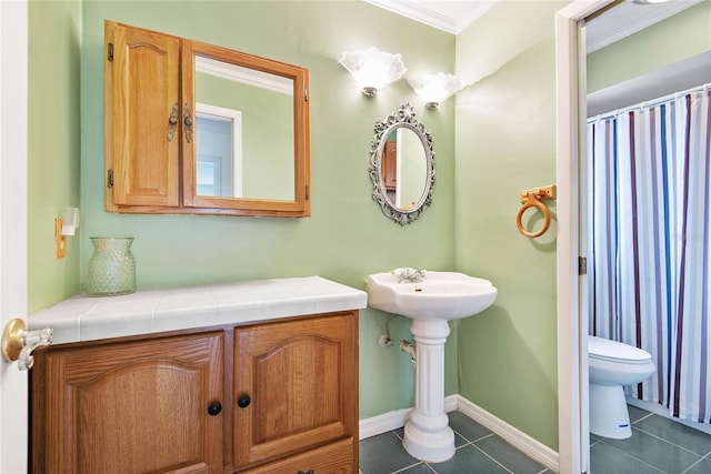 bathroom featuring baseboards, toilet, ornamental molding, tile patterned floors, and curtained shower