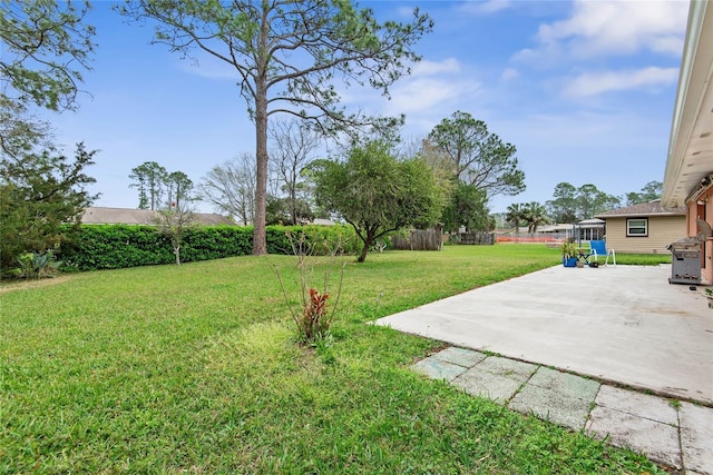 view of yard with a patio and fence