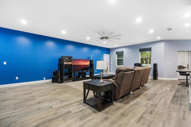 living room featuring ceiling fan and light wood-type flooring