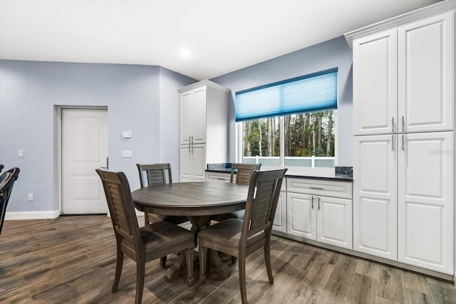 dining area with dark wood-type flooring