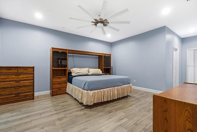 bedroom featuring ceiling fan and light hardwood / wood-style floors