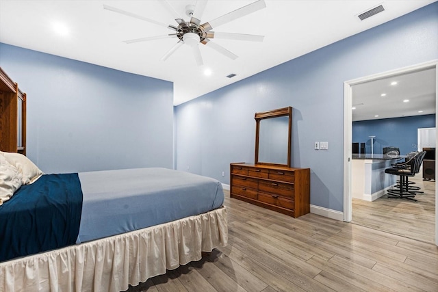 bedroom with ceiling fan and light hardwood / wood-style flooring