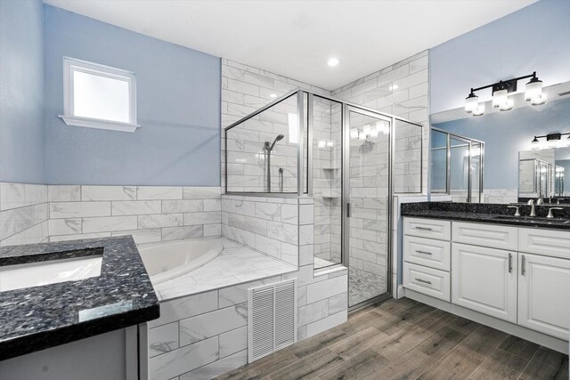 bathroom featuring vanity and plus walk in shower