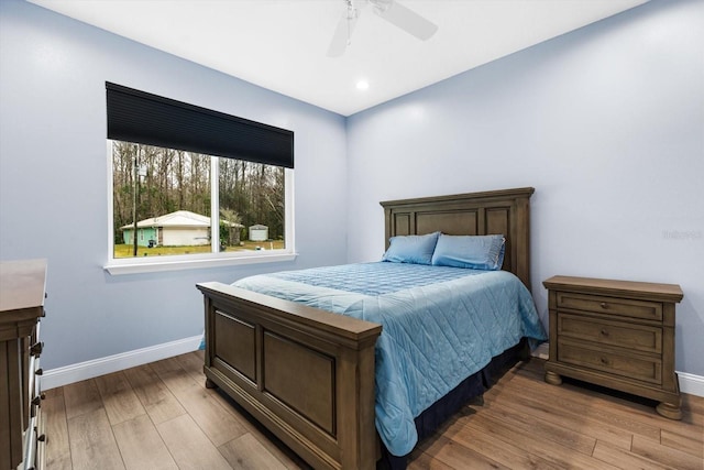 bedroom featuring ceiling fan and light hardwood / wood-style flooring