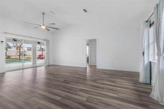 spare room featuring ceiling fan, dark hardwood / wood-style flooring, and high vaulted ceiling