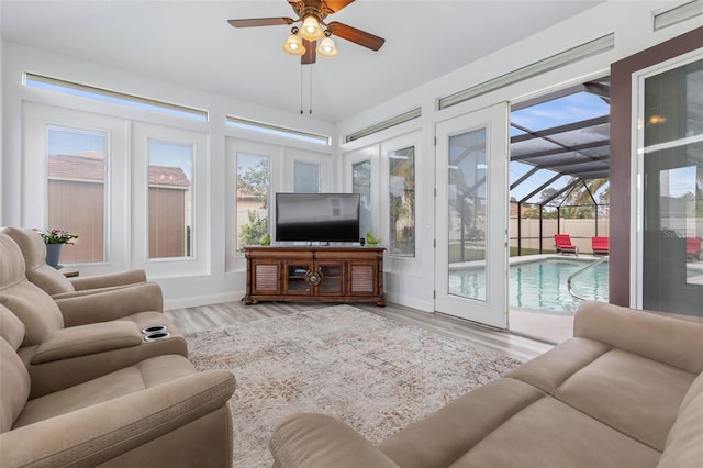 sunroom featuring a wealth of natural light and ceiling fan