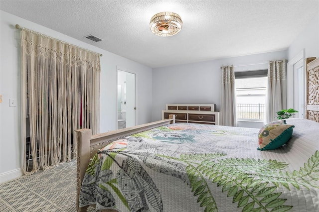 bedroom featuring a textured ceiling