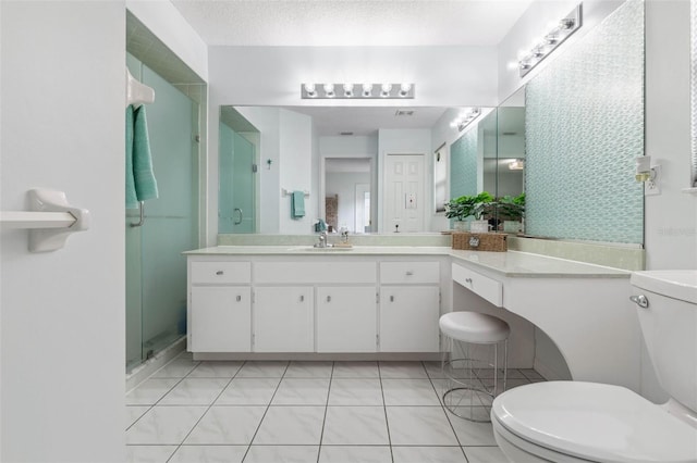 bathroom featuring toilet, a shower with shower door, a textured ceiling, vanity, and tile patterned flooring