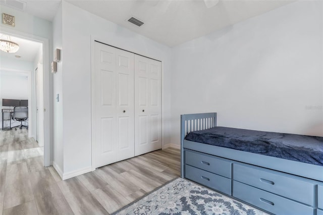 bedroom featuring a closet and light hardwood / wood-style flooring