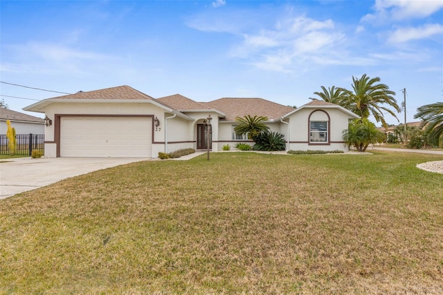 ranch-style home featuring a garage and a front yard