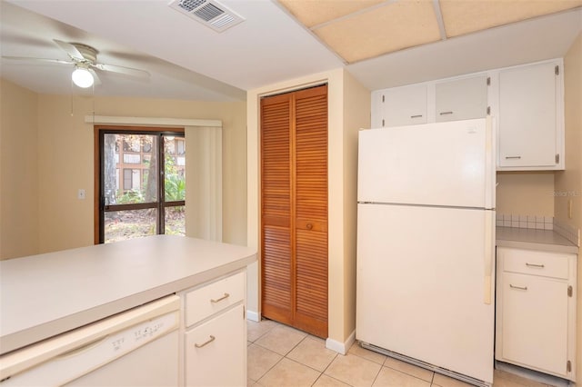 kitchen with white cabinetry, white appliances, light tile patterned flooring, and ceiling fan