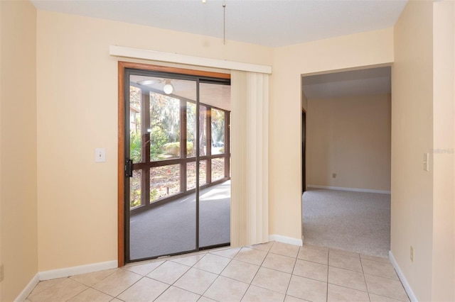 doorway with light tile patterned flooring